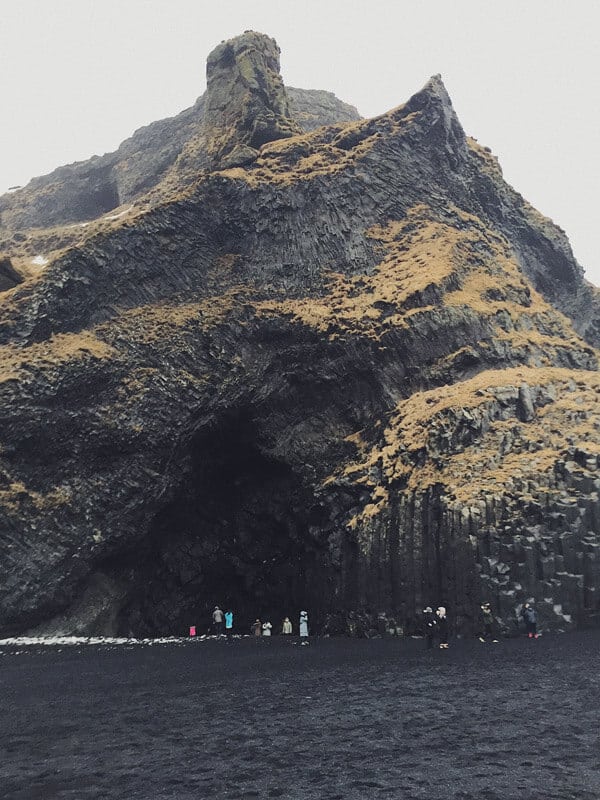  Hálsanefshellir cave at the bottom of Gardar on Reynisfjara beach.  Things to do and see in Vik Iceland! Visiting the black sand beach is at the top of the list. It was truly unlike anything I have every seen before. Whether you are traveling to Iceland in the winter or summer you will not want to miss a trip to Vik. | Avenly Lane Travel #vik #iceland #blacksandbeaches #beach #island #europe #europebucketlist