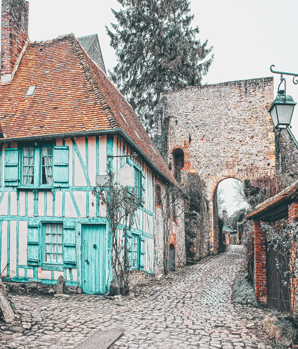 Fairytale Places that Really Exist like this beautiful village in France! This charming small town in France is a popular tourist attraction will not disappoint you on your vacation in Europe! Click to avenlylane.com to see 15 of the most beautiful fairytale travel destinations in the world! #wanderlust #france #traveltips #europe #bucketlist #travel #villages #travelmore #castles #portugal #traveling #palace #roadtrip #avenlylane #avenlylanetravel