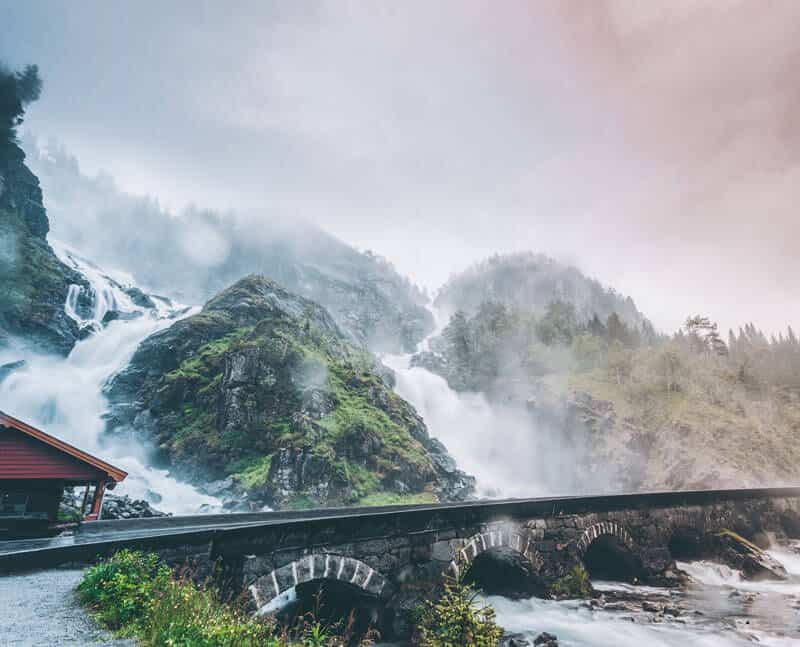 Powerful twin waterfall Latefoss or Latefossen and six arched bridge along Route 13 Odda Hordaland County in Norway.