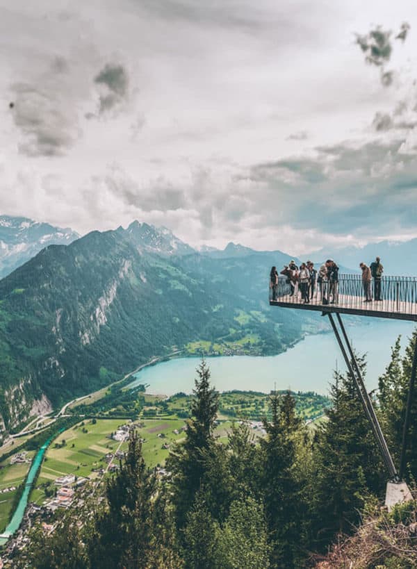 Interlaken, Switzerland, one of the The 15 Prettiest Towns in Switzerland. If you are planning a vacation in Switzerland you HAVE to visit these 15 top places in Switzerland. They are incredible! See 14 others on www.avenlylane.com #avenlylanetravel #avenlylane #travelinspiration #travel #beautifulplaces #europe #switzerland